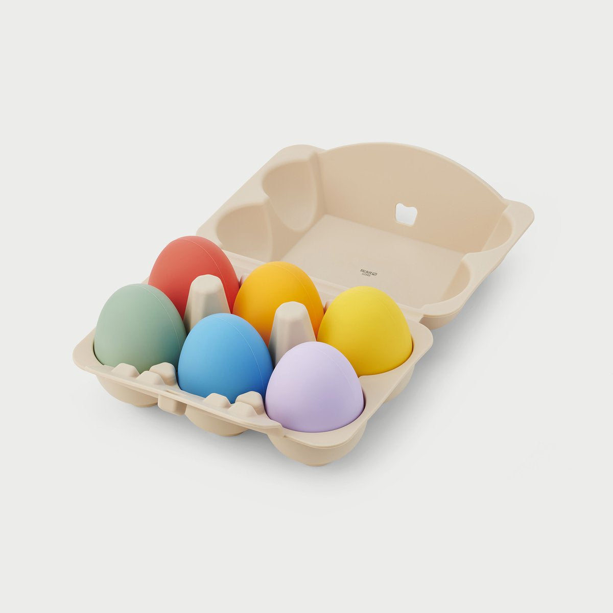 Bunte Spielzeug Eier in einem Eierkarton für Kinder zum Spielen, Sortieren und Entdecken verschiedener Farben.