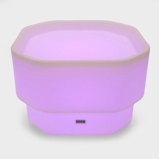 Leuchtender LED Pflanzkübel in Violett mit moderner Form für stimmungsvolle Beleuchtung im Innenbereich.